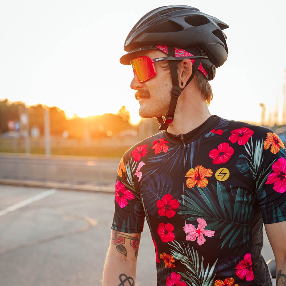 a man wearing a floral shirt and helmet