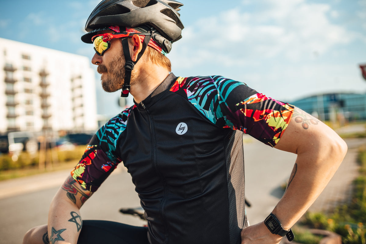 Rider in a STEEP jersey with a bold tropical print